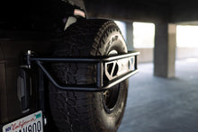 Load image into Gallery viewer, DV8 Offroad 21-23 Ford Bronco Spare Tire Guard &amp; Accessory Mount