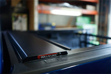 Load image into Gallery viewer, Roll-N-Lock 08-16 Ford F-250/F-350 Super Duty 80-1/4in E-Series Retractable Tonneau Cover