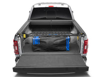 Load image into Gallery viewer, Roll-N-Lock 21-22 Ford F-150 (67.1in. Bed Length) Cargo Manager