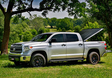 Load image into Gallery viewer, UnderCover 05-15 Toyota Tacoma 6ft SE Bed Cover - Black Textured (Req Factory Deck Rails)