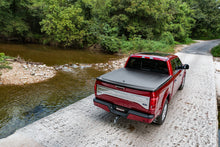 Load image into Gallery viewer, UnderCover 07-13 GMC Sierra 1500 / 07-14 Sierra 2500/3500 HD 6.5ft SE Bed Cover - Black Textured