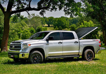 Load image into Gallery viewer, UnderCover 05-15 Toyota Tacoma 5ft SE Bed Cover - Black Textured (Req Factory Deck Rails)