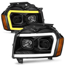 Load image into Gallery viewer, ANZO 2005-2007 Jeep Grand Cherokee Projector Headlights w/ Light Bar Switchback Black Housing